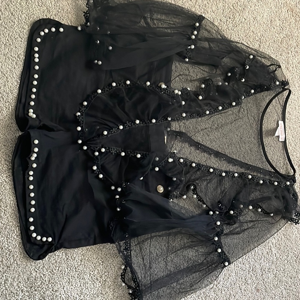 Black sequence blouse and short pants set.